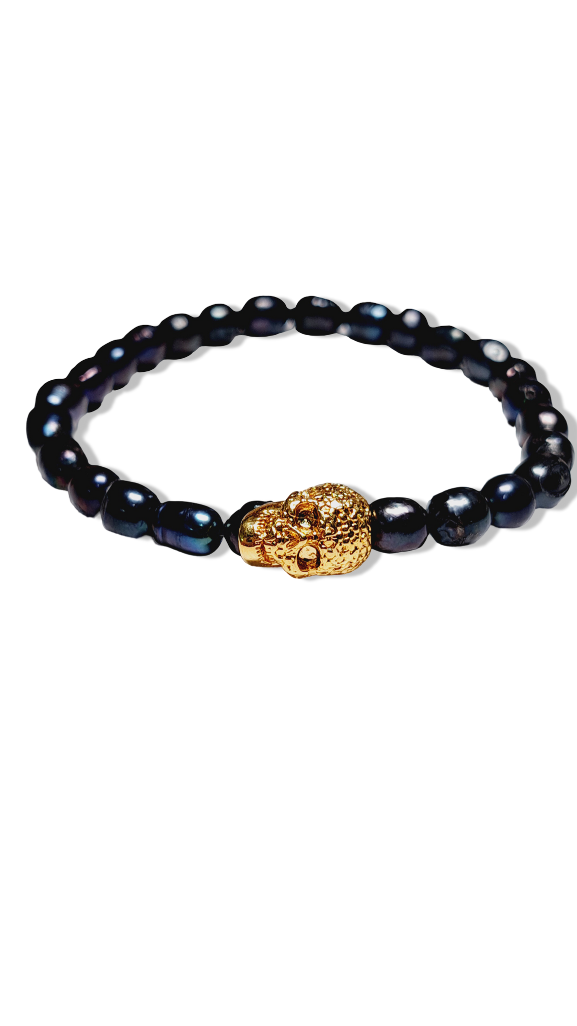 PULSERA PERLA NEGRA CALAVERA DORADO